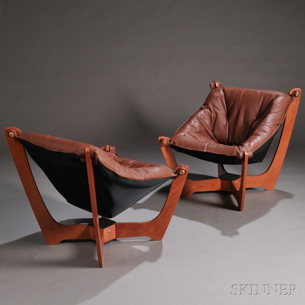 Appraisal: Two Scandinavian Design Lounge Chairs Leather and laminated wood Fourth