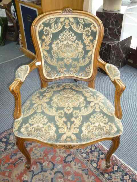 Appraisal: A LOUIS XV STYLE OPEN ARMCHAIR with upholstered back arms