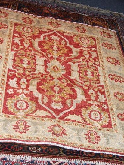 Appraisal: A MODERN TURKISH USAK RED GROUND RUG - open foliate