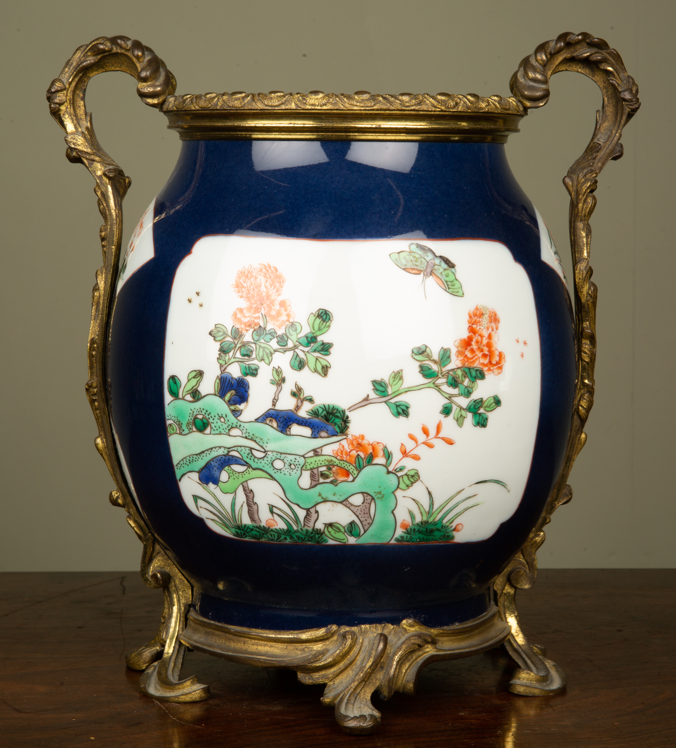 Appraisal: A Chinese porcelain blue ground ovoid vase decorated with cartouches