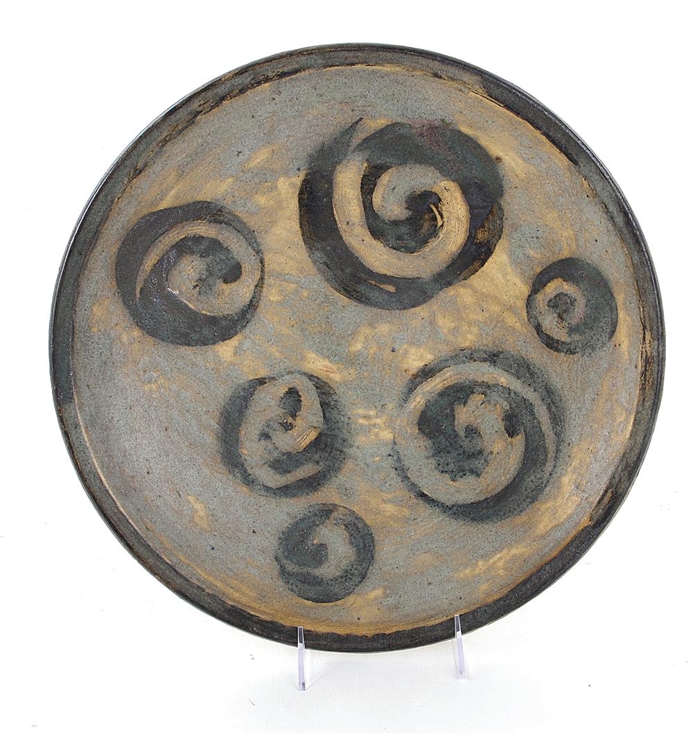 Appraisal: Asian glazed stoneware charger th th century swirl design Dia