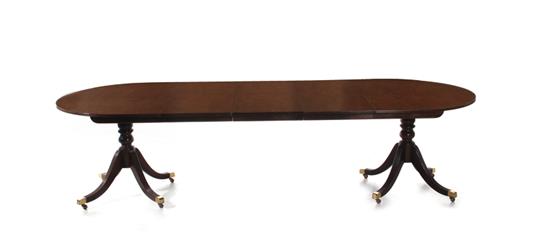 Appraisal: Baker mahogany dining table Historic Charleston fitted with three leaves