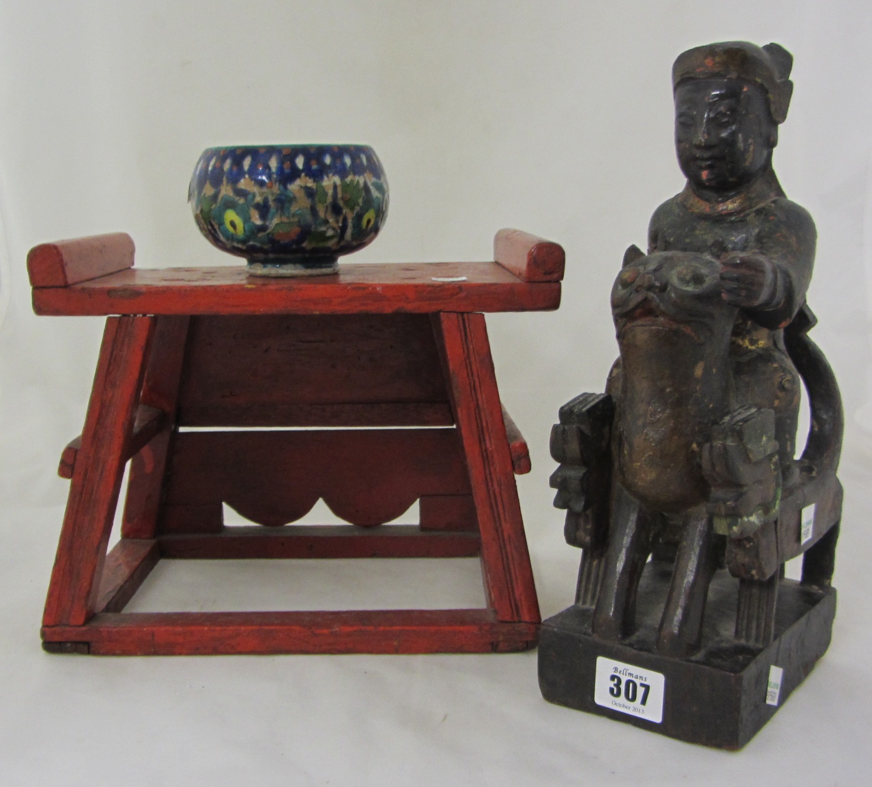 Appraisal: A Chinese painted wood group of a man seated on