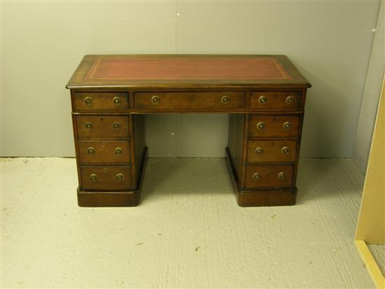 Appraisal: Nineteenth century mahogany pedestal desk of seven drawers on plinth