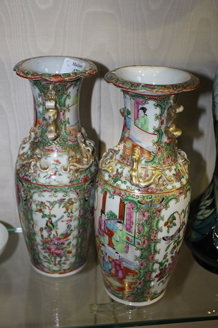 Appraisal: A PAIR OF CHINESE CANTON BALUSTER VASES with polychrome panels