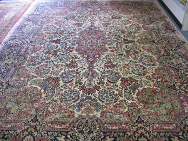 Appraisal: Kerman Persian Handmade Room Size Rug semi-antique elaborate floral ivory