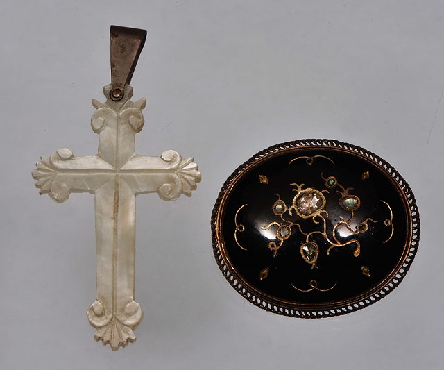 Appraisal: A DIAMOND AND BLACK ENAMEL OVAL MOURNING BROOCH and a