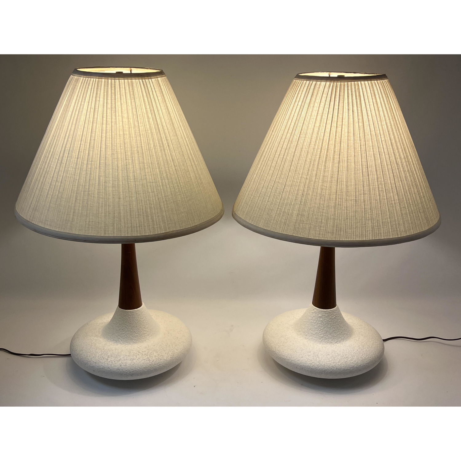 Appraisal: Pair s Modern Table Lamps White pottery and walnut stems