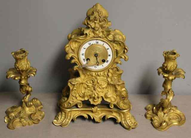 Appraisal: th Century French Gilt Bronze Clock Garniture Including clock and