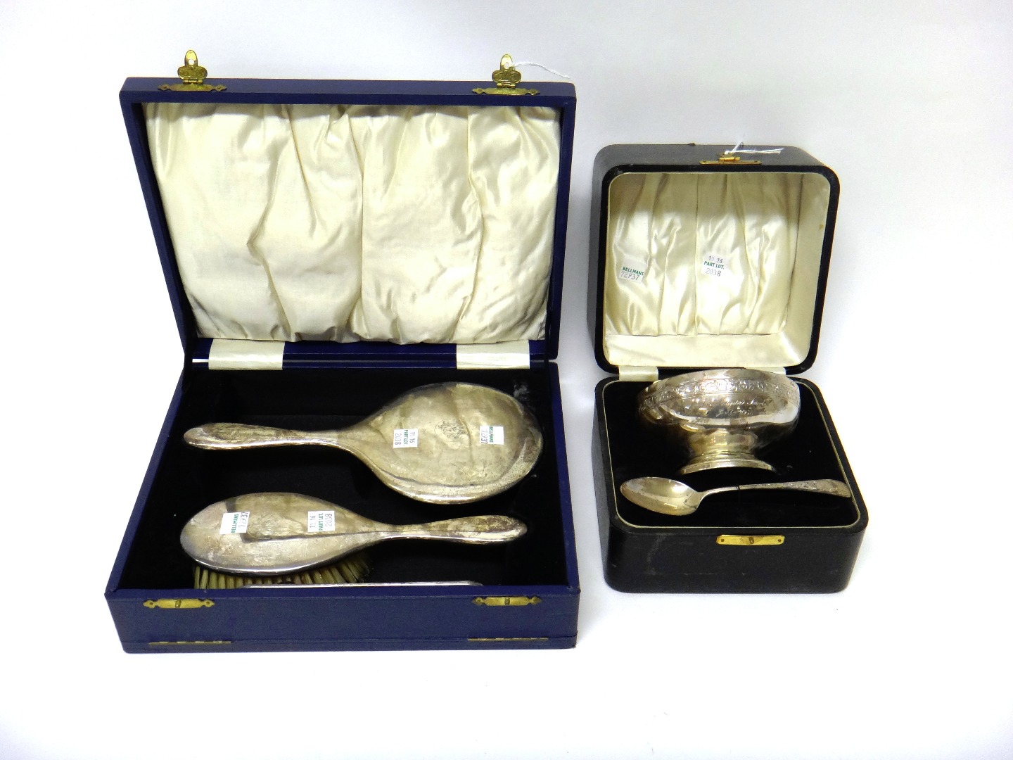 Appraisal: A silver christening bowl and spoon decorated with an engraved