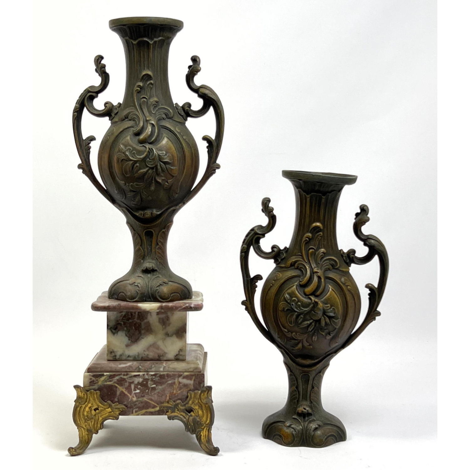 Appraisal: Two Decorative Handled Metal Urns One with marble and metal