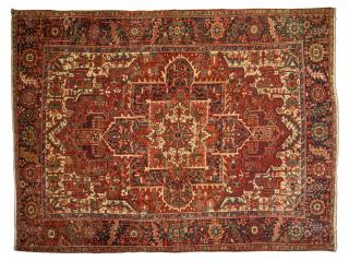 Appraisal: A PERSIAN HERIZ TRIBAL RUG A PERSIAN HERIZ TRIBAL RUG