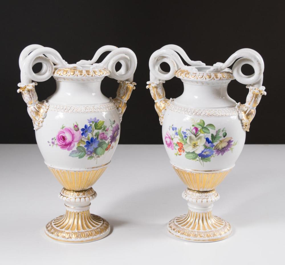 Appraisal: PAIR OF MEISSEN PORCELAIN FOOTED URNS with coiled serpent handles