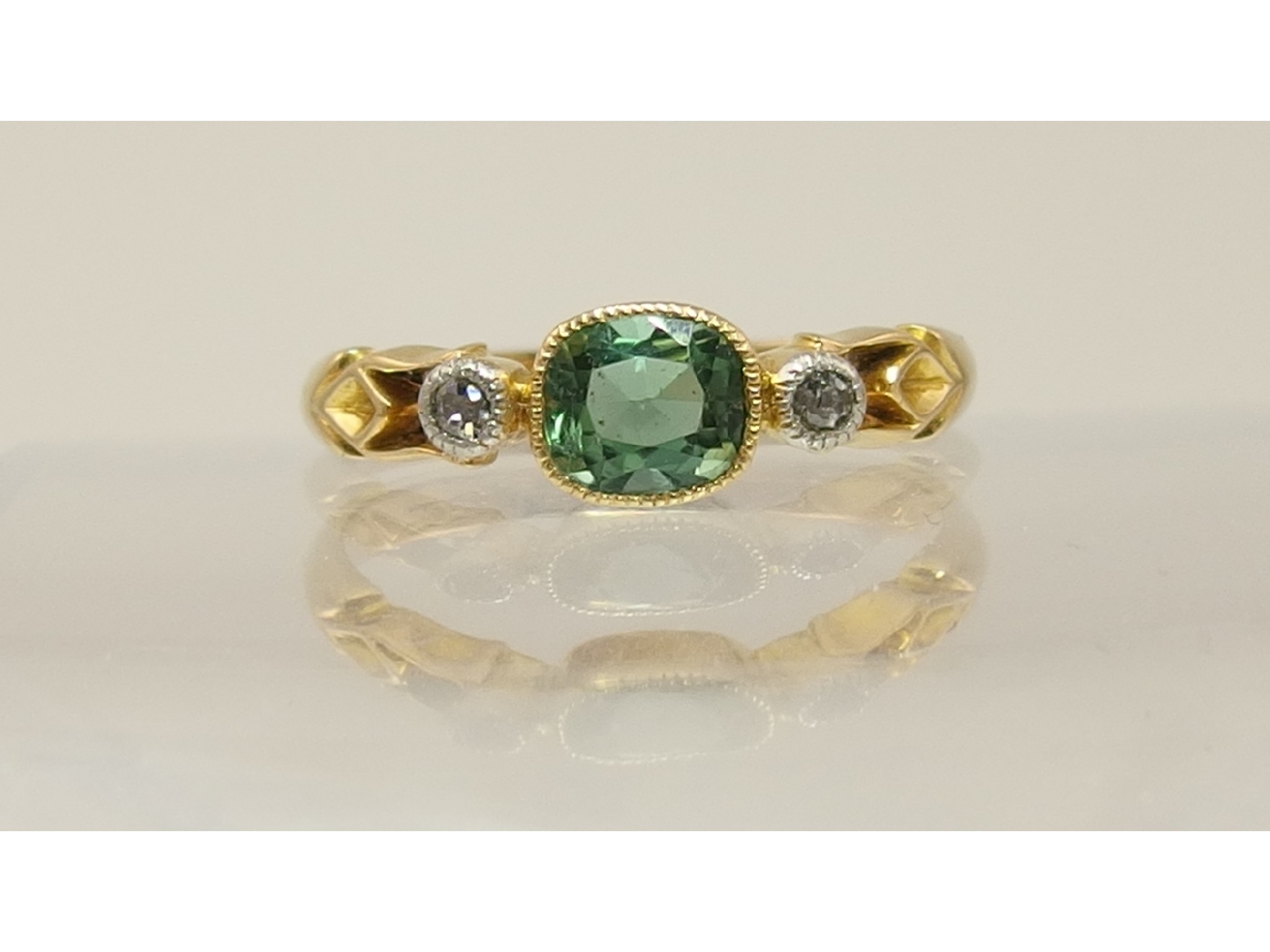 Appraisal: An ct green tourmaline and diamond ring