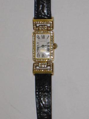 Appraisal: A CARTIER COCKTAIL WATCH with quartz movement oblong white enamel