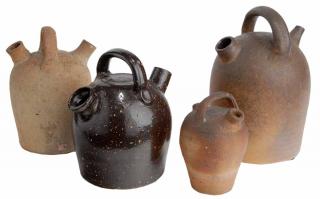 Appraisal: Four Stoneware Monkey Jugs brown glazed jug with yellow speckles