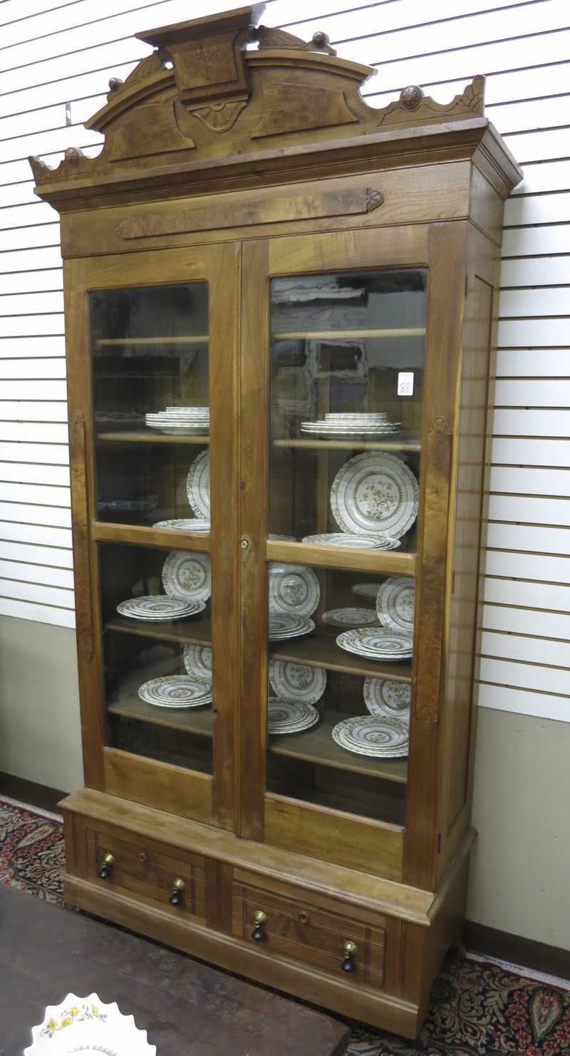 Appraisal: VICTORIAN WALNUT CABINET BOOKCASE ON BASE American last quarter of