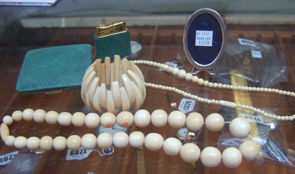 Appraisal: Two single row necklaces of graduated ivory beads an ivory