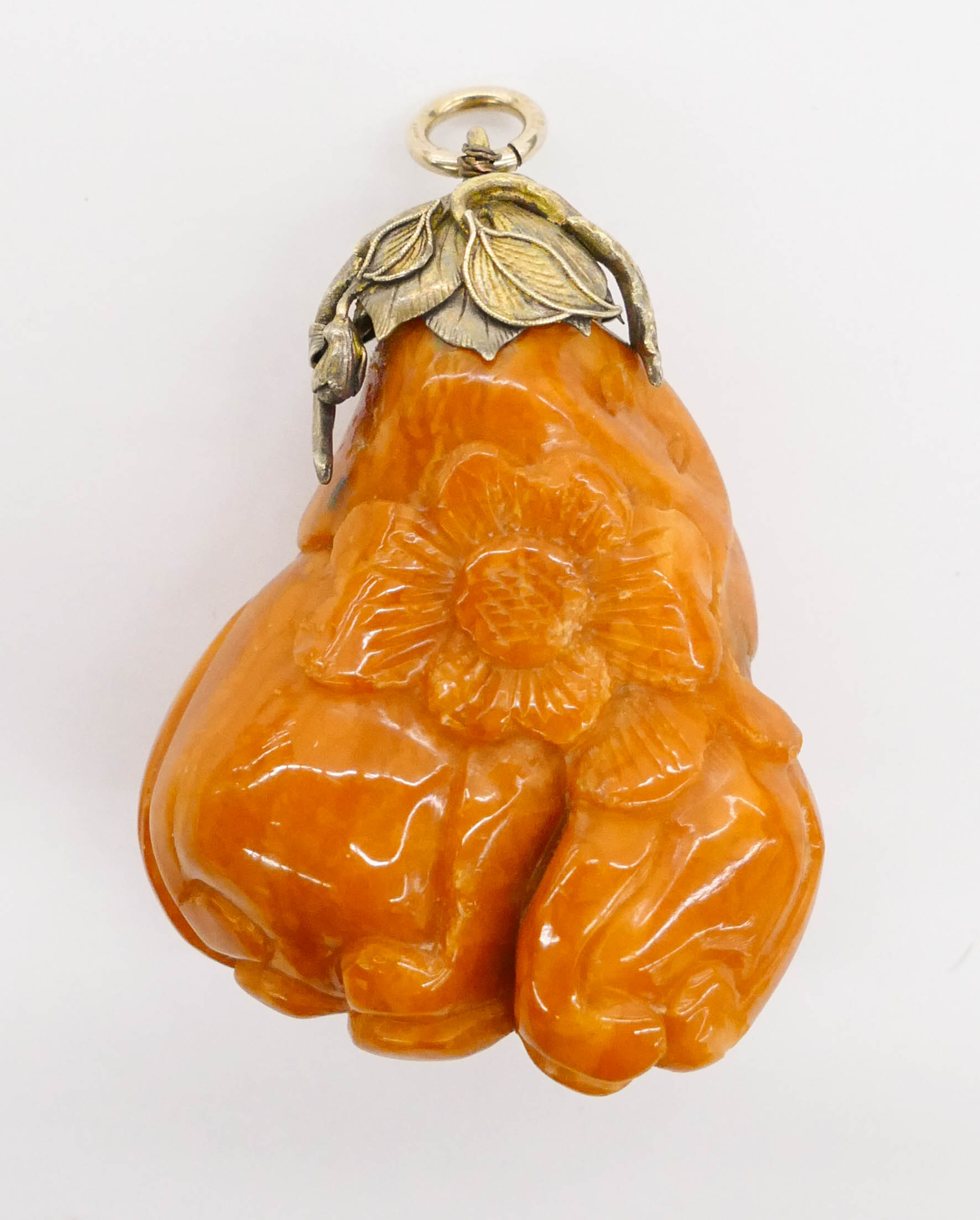 Appraisal: Chinese Amber Buddhist Hand Citron Pendant '' A butterscotch amber