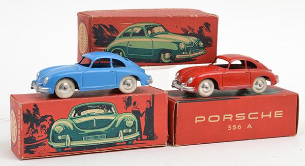 Appraisal: THREE QUIRALU DIECAST PORSCHE S SOME REPAINTING E BOXES F-G