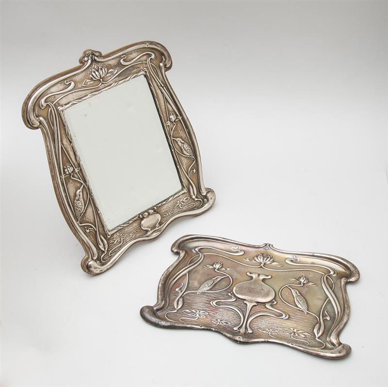 Appraisal: ENGLISH ART NOUVEAU SILVER-ON-OAK DRESSING TABLE MIRROR AND A MATCHING