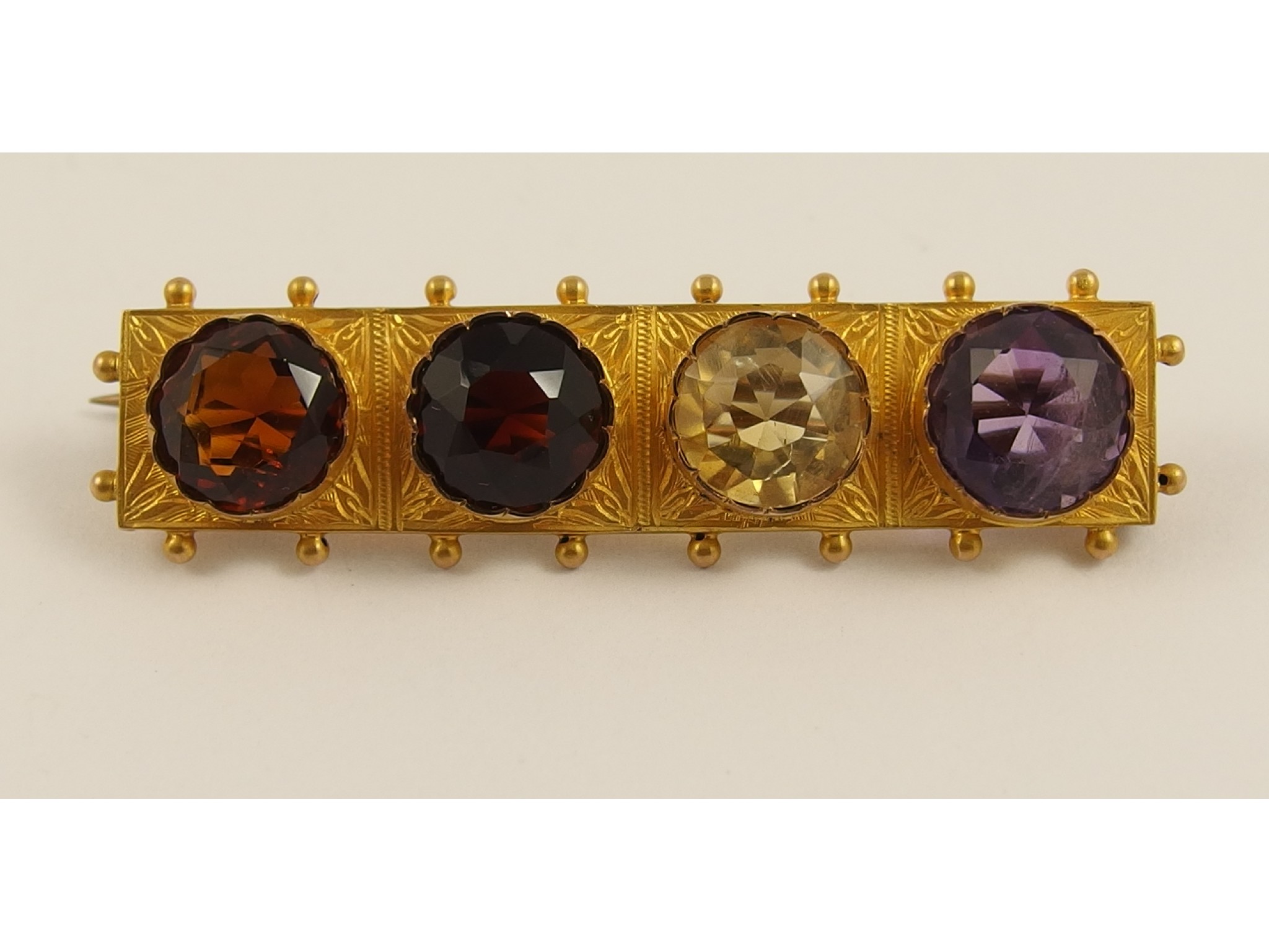 Appraisal: A Victorian yellow metal brooch set with amethyst garnet and