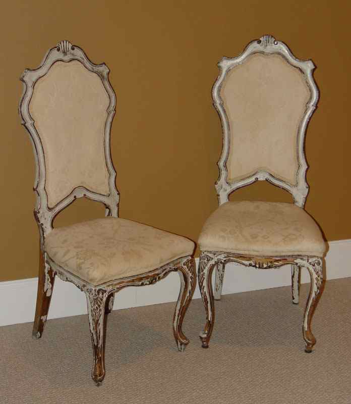 Appraisal: PAIR OF ITALIAN CARVED AND PAINT DECORATED CHAIRS Unusual high