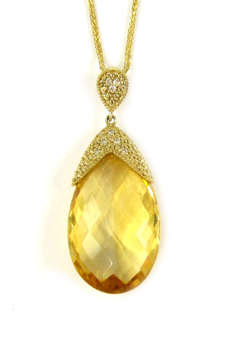 Appraisal: CITRINE AND FOURTEEN KARAT GOLD PENDANT NECKLACE the pendant suspended