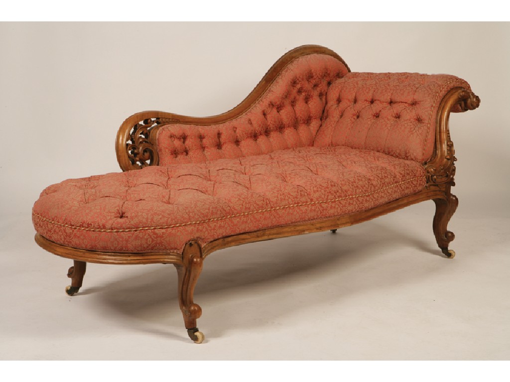 Appraisal: A VICTORIAN WALNUT FRAMED BUTTON-UPHOLSTERED CHAISE LONGUE the raised arm