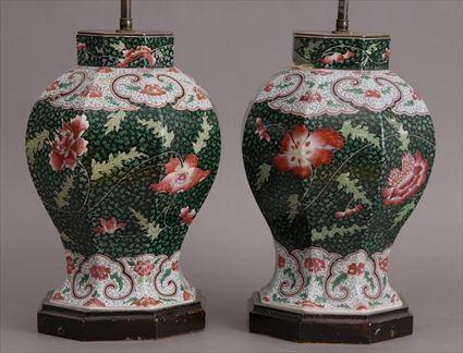 Appraisal: PAIR OF CHINESE FAMILLE VERTE BLACK-GROUND JARS MOUNTED AS LAMPS