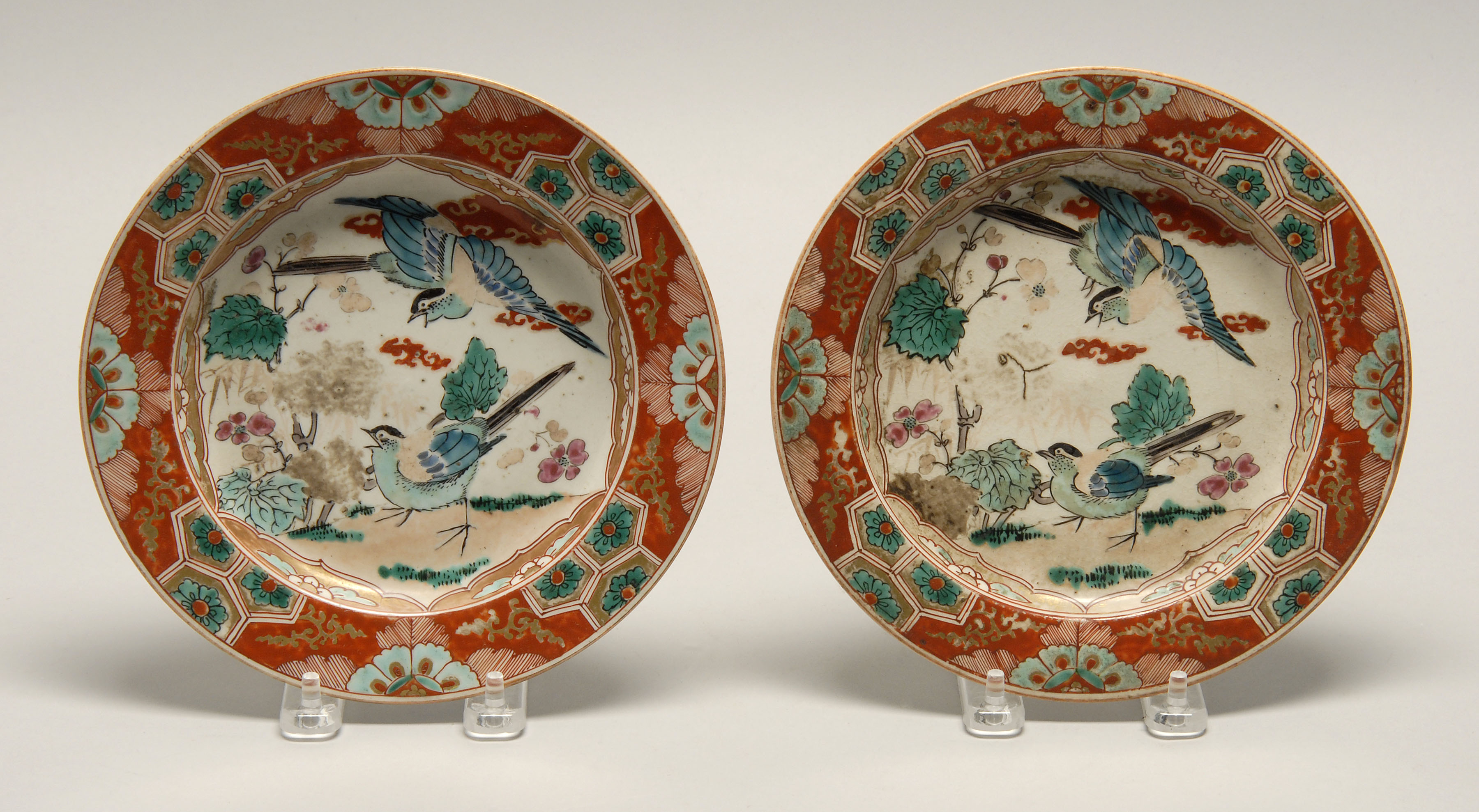 Appraisal: PAIR OF KUTANI POTTERY DISHES Meiji PeriodWith bird and flower