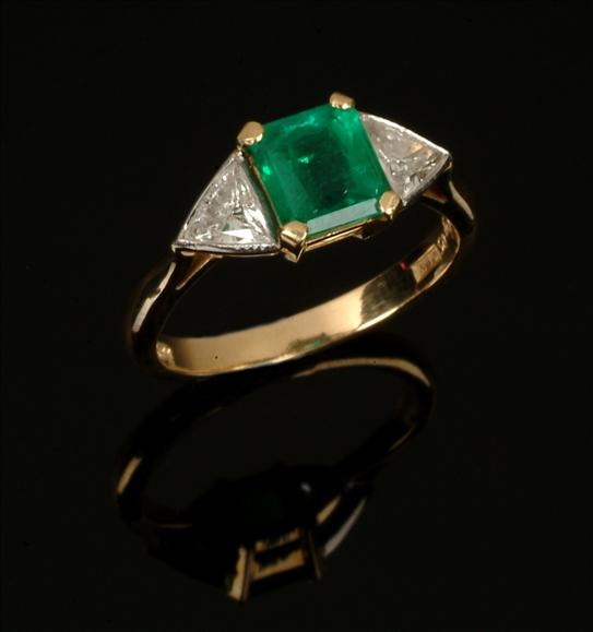 Appraisal: An emerald and diamond ring the central square cut emerald