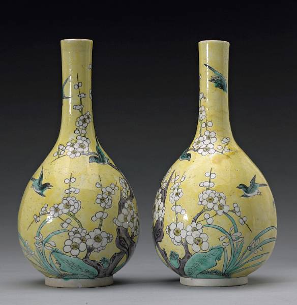 Appraisal: A pair of famille verte enameled porcelain stick neck vases