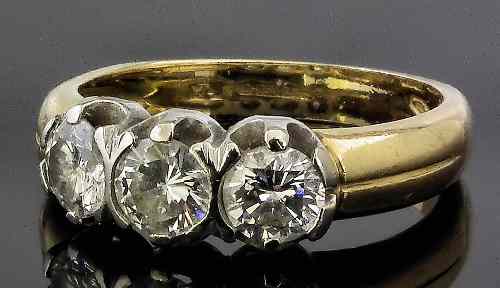 Appraisal: A modern ct gold mounted three stone diamond ring set