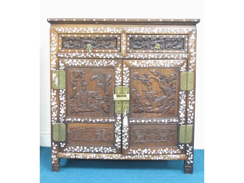 Appraisal: An oriental hardwood Cabinet with two frieze drawers above pair