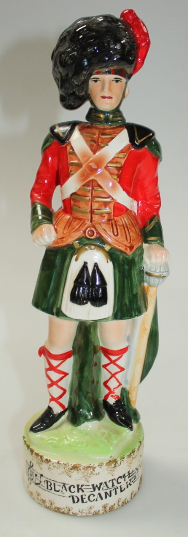 Appraisal: A thC earthenware Black Watch decanter formed as a soldier