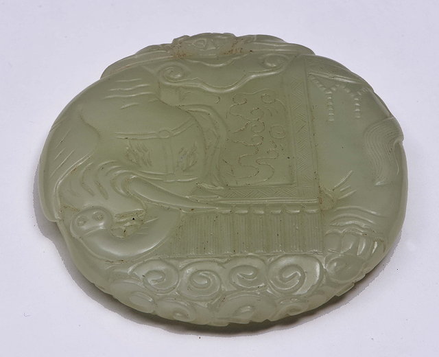 Appraisal: A CHINESE WHITE JADE CIRCLE SHAPED PENDANT carved as an