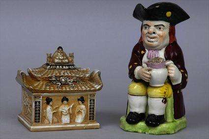 Appraisal: ENGLISH POTTERY TOBY JUG AND A LIDDED PAGODA BOX The