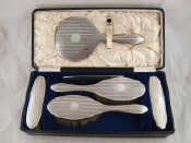 Appraisal: A boxed silver dressing table set of hand mirror comb