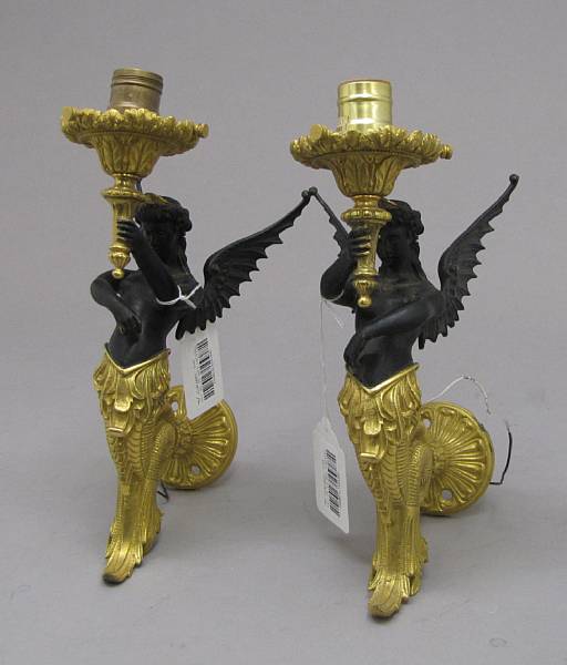 Appraisal: A pair of Empire style patinated and gilt bronze figural