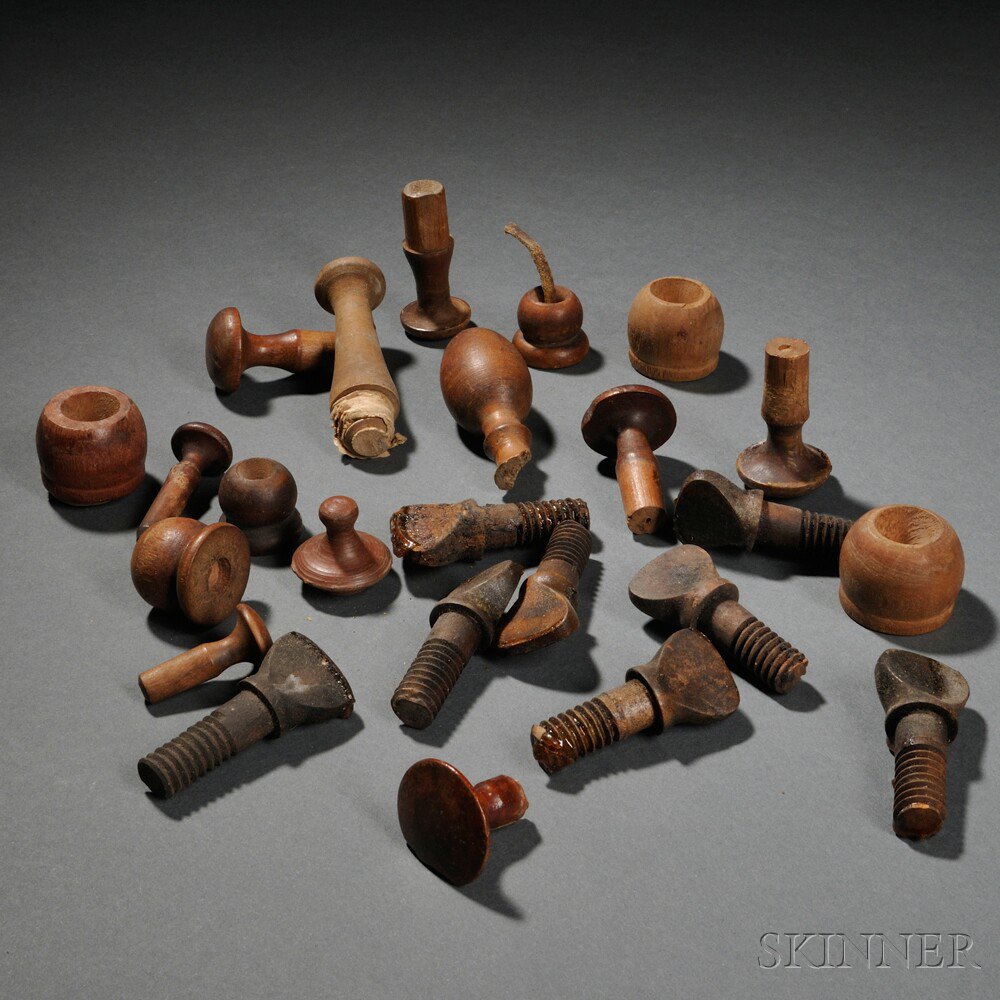 Appraisal: Twenty-two Shaker-made Wooden Thumbscrews Tilter Bobs and Pegs eight carved