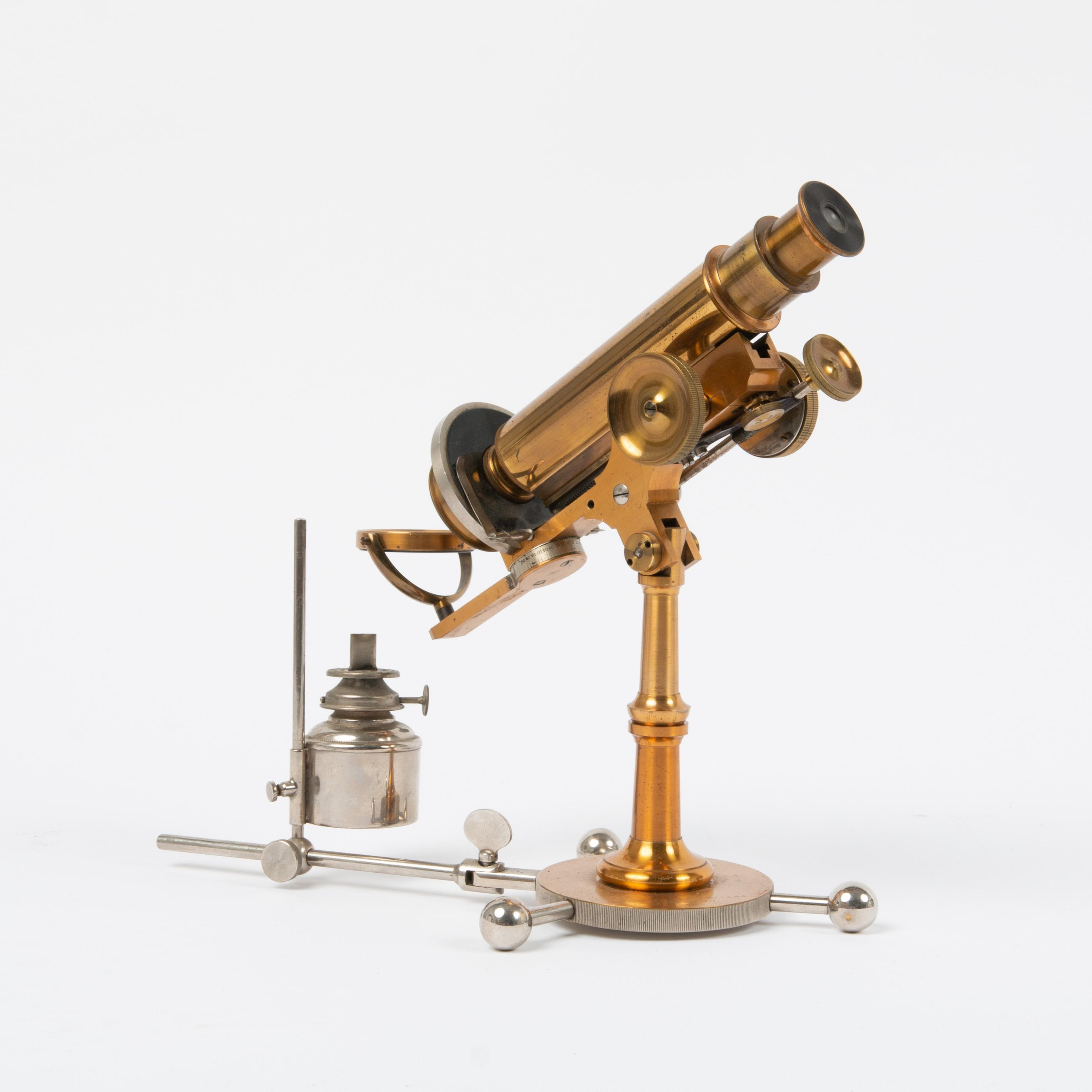 Appraisal: GRIFFITH CLUB MICROSCOPE WITH BURNER CIRCA - A very rare