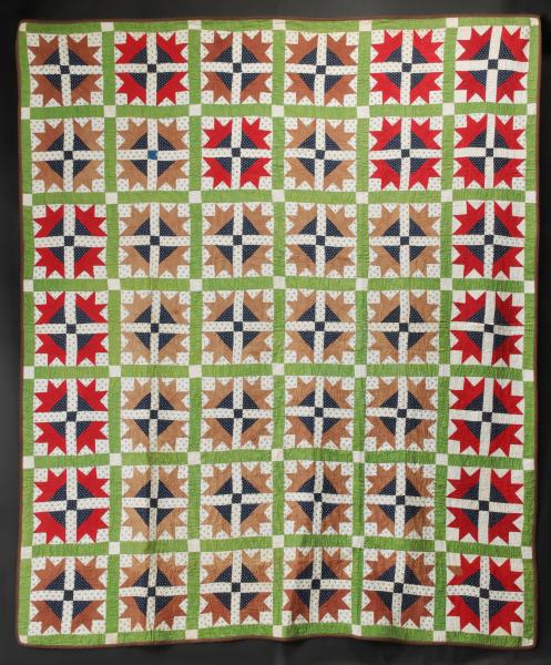 Appraisal: A COLORFUL ANTIQUE 'BEAR'S PAWS' PATTERN QUILTThe forty-two Bear's Paws