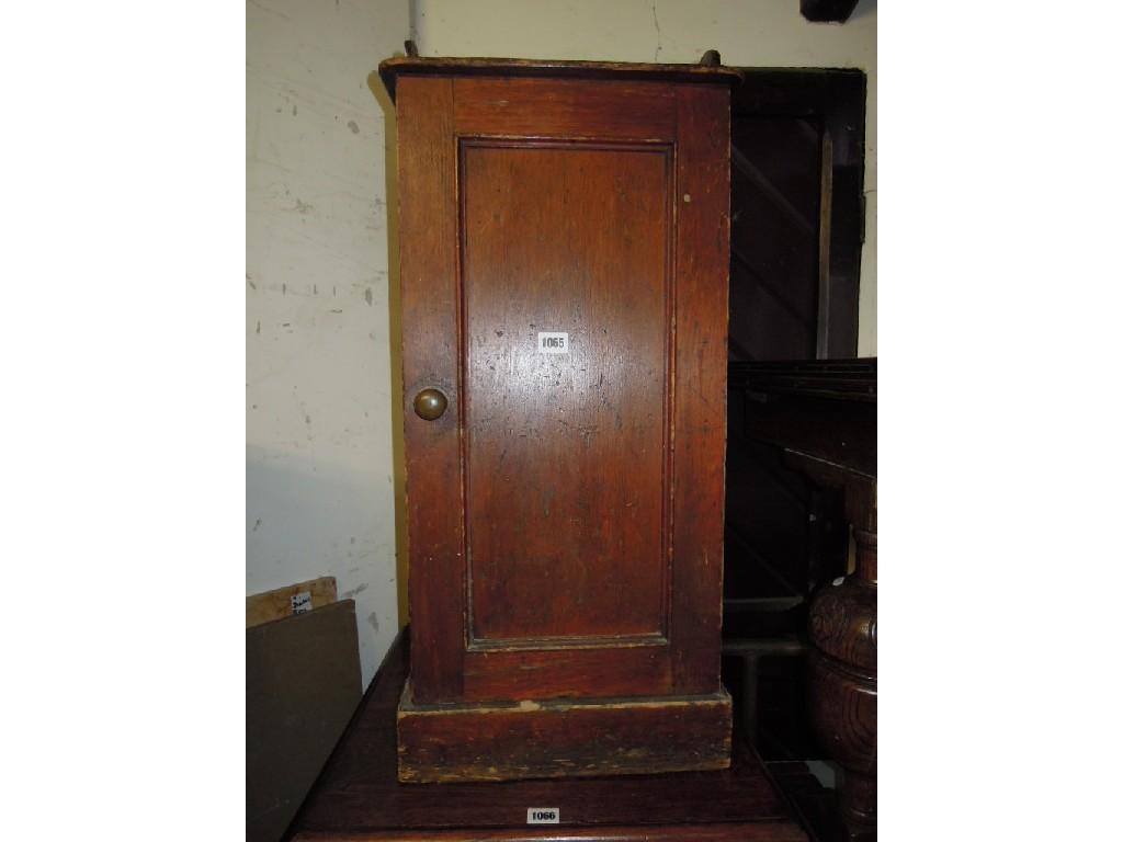 Appraisal: A Victorian stained pine bed side cupboard with raised three