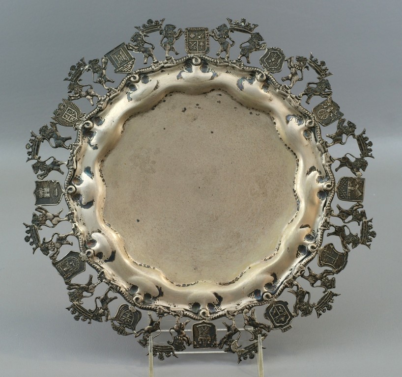 Appraisal: Continental silver tray with border depicting various coats of arms