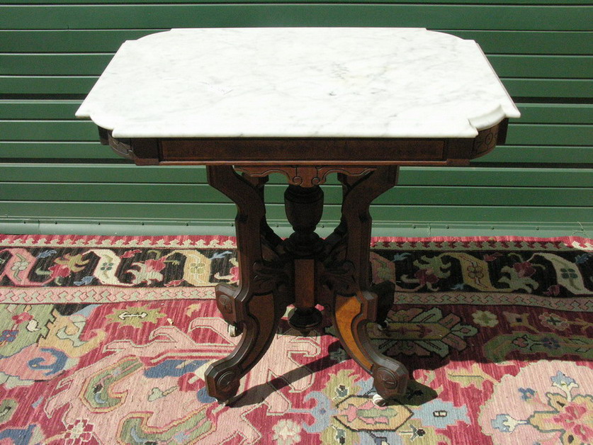 Appraisal: VICTORIAN WALNUT EASTLAKE MARBLE PARLOR TABLE Size by by