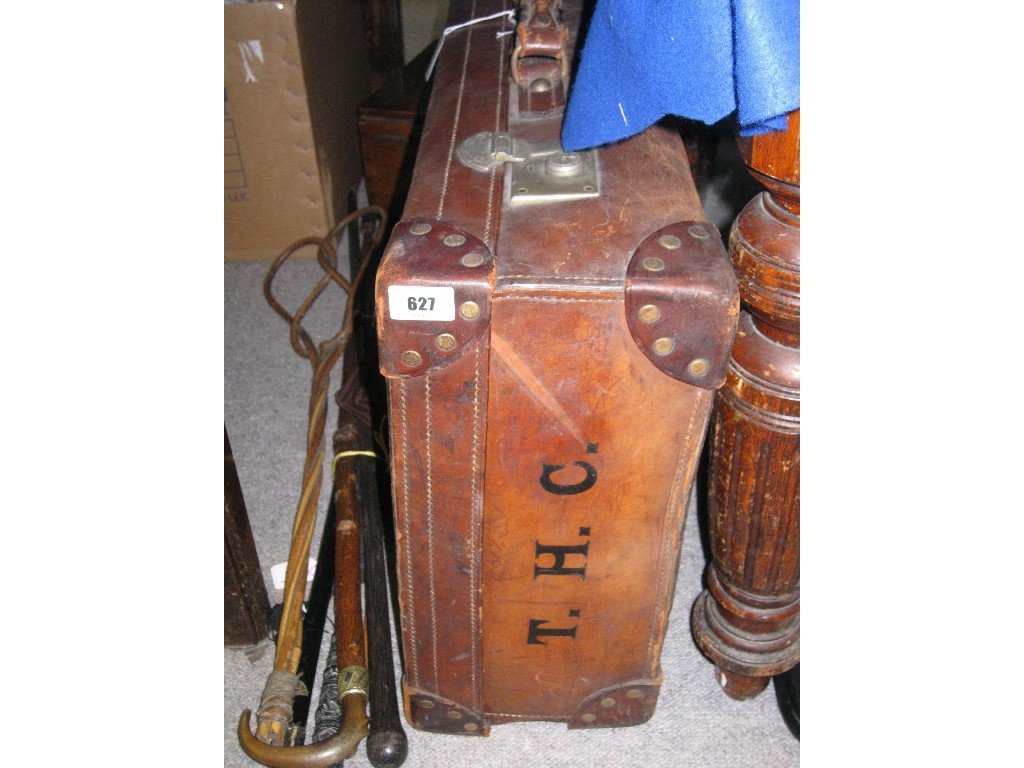 Appraisal: Leather suitcase bearing the initials T H C