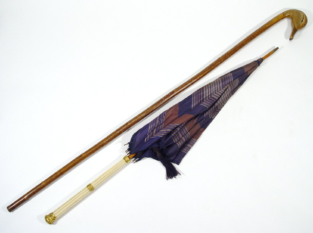 Appraisal: Bone handled parasol with embossed gilt metal collars together with