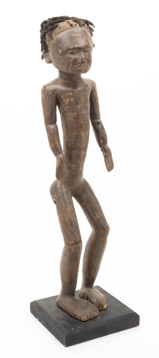 Appraisal: Sale Lot A Carved Ethnographic Figure raised on a stand