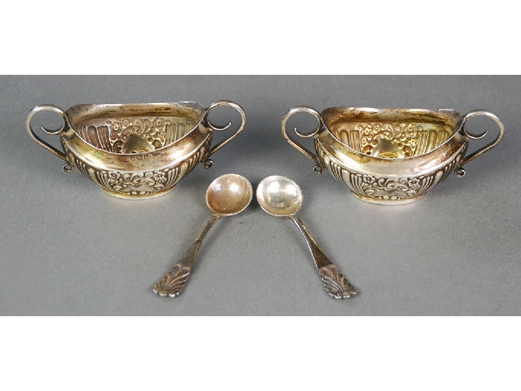 Appraisal: PAIR OF LATE VICTORIAN SILVER TWO HANDLED OVAL SALTS repousse